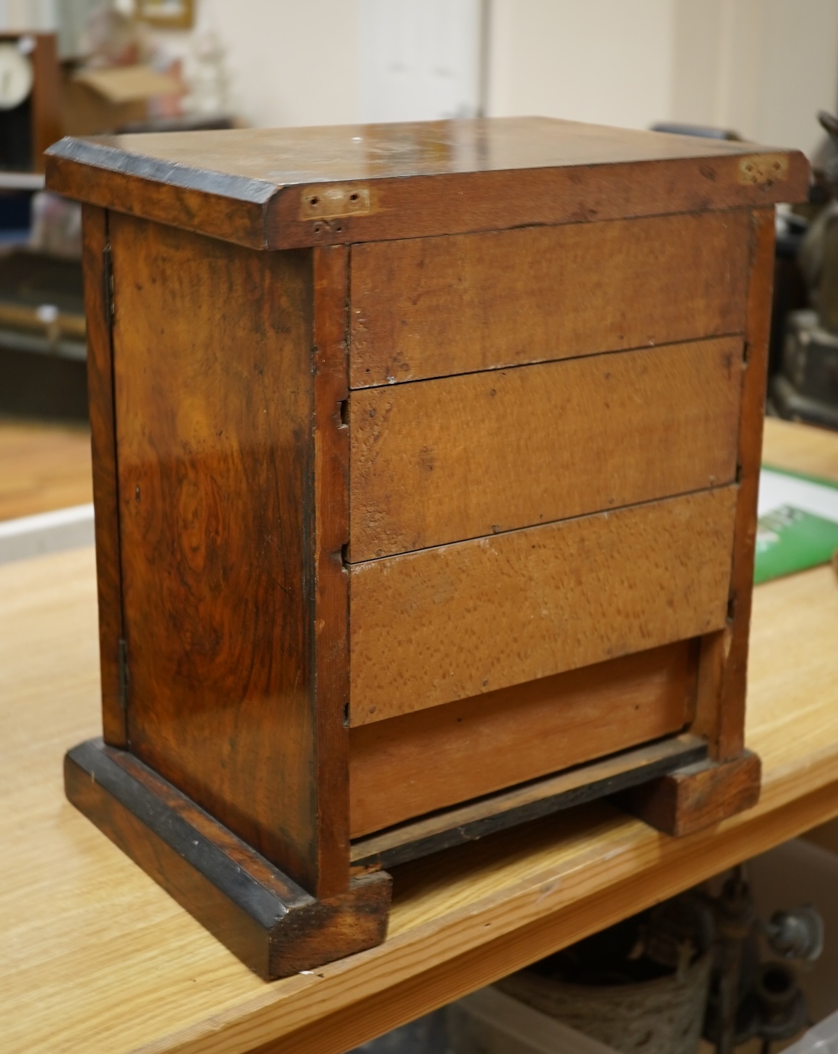 A Victorian walnut miniature two door tabletop cabinet/chest with two short and three long drawers inside. 32cm wide x 37cm high